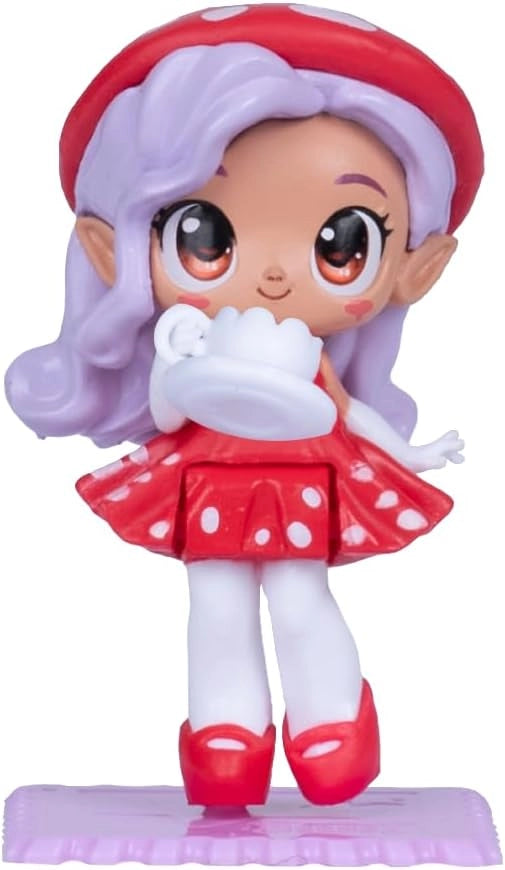 Toy figure with white hair and red outfit on a white background