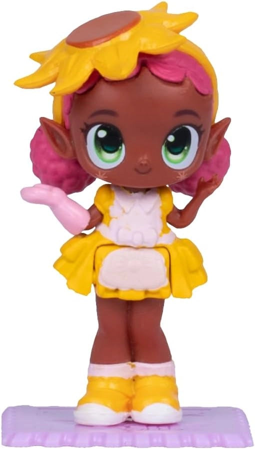 Toy figure with yellow hair and outfit on a white background