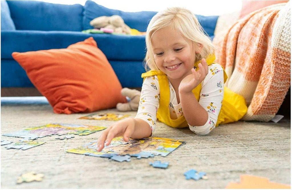 Child assembling the Ravensburger Peppa Pig Fun In The Sun jigsaw puzzle, perfect for improving fine motor skills."