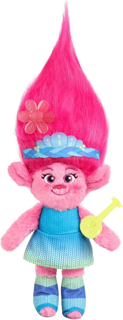 Colorful toy gnome with pink hair and a blue dress on a white background
