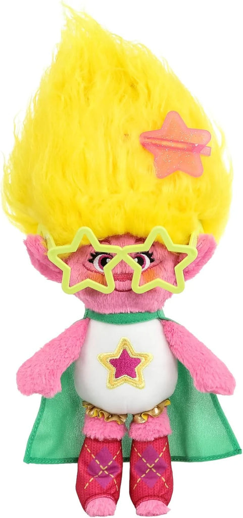 Plush toy with yellow hair, star-shaped glasses, and a green cape on a white background
