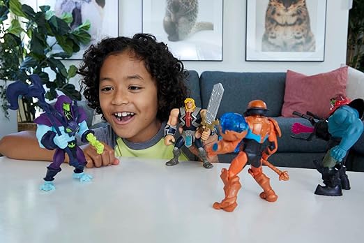 A child is playing with action figures. action figures are standing on the table