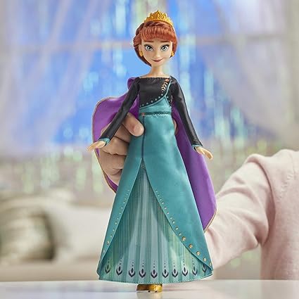"Disney Frozen 2 Musical Adventure Anna Singing Doll, dressed in her iconic outfit, singing the song "Some Things Never Change" from the movie. Perfect for fans of Frozen 2, this doll brings the magic of the film to life with its musical feature."