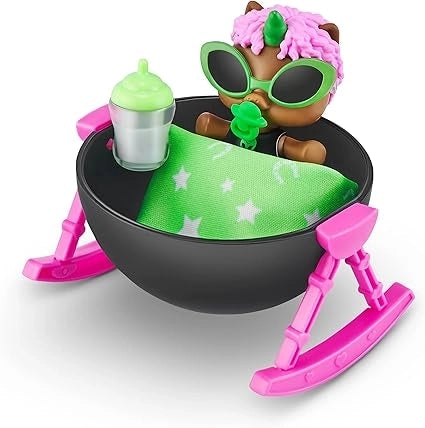 Green Toy figure with colorful hair and accessories in a black bowl with pink legs on a white background