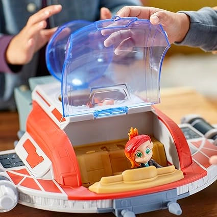 Toy spaceship with a figure inside, held by two hands.