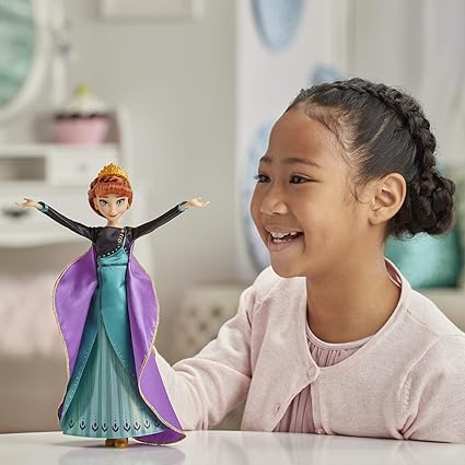 A girl is playing with anna singing doll
