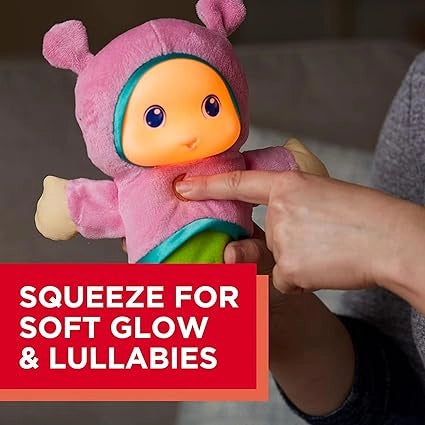 Plush toy with glowing face being squeezed by a hand, with text 'Squeeze for soft glow & lullabies' on a red background.