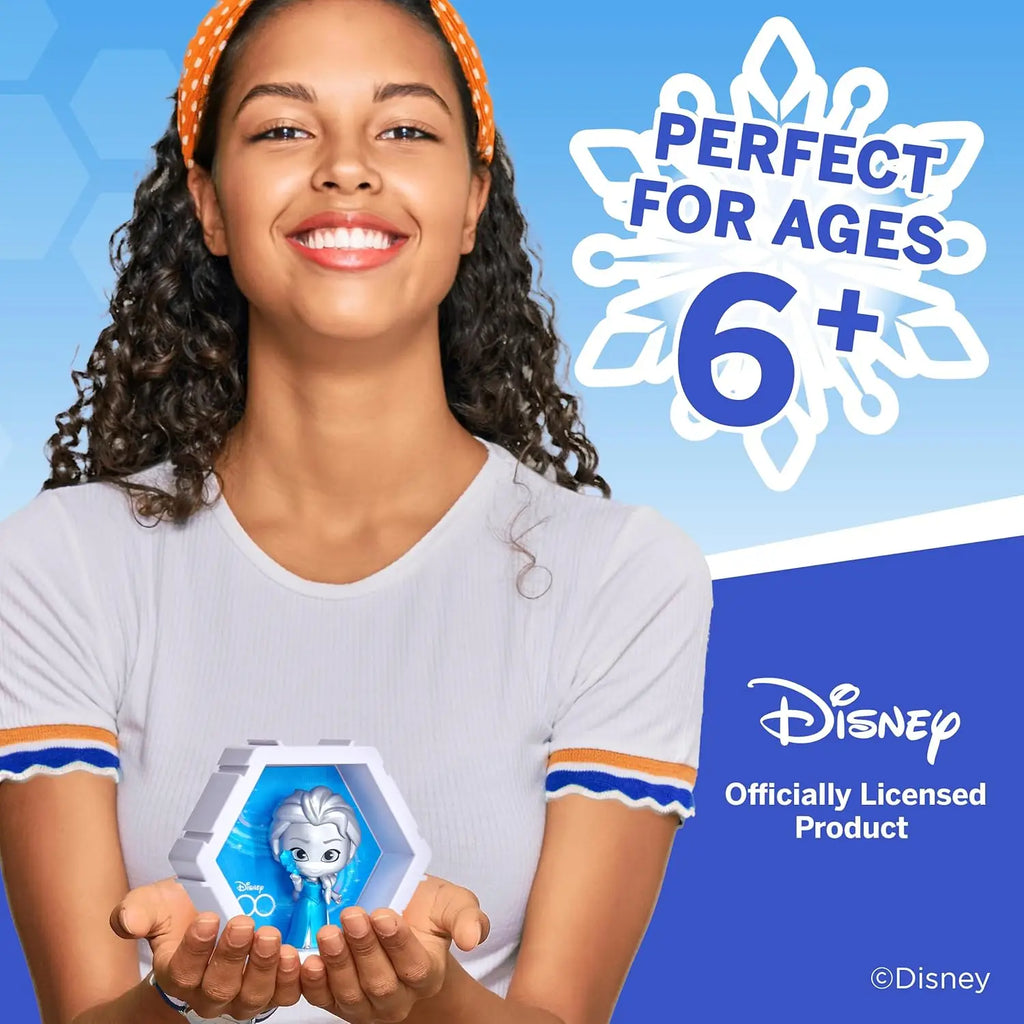 A girl holding WOW! PODS - 4D Disney 100 - Elsa