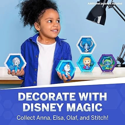 Child holding Disney-themed decor items with text 'Decorate with Disney Magic' on a blue background.
