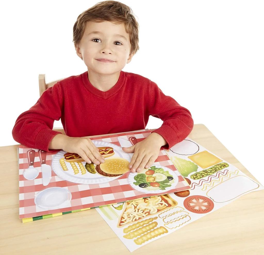 Child is playing with Melissa and Doug Make-A-Meal Sticker pad
