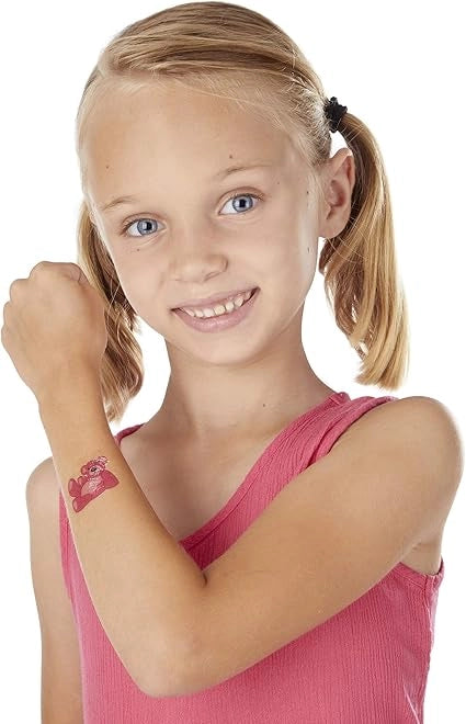 Girl is showing temporary tattoo on hand