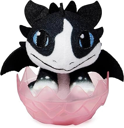 Plush toy of a black and white creature with blue eyes in a pink egg on a white background