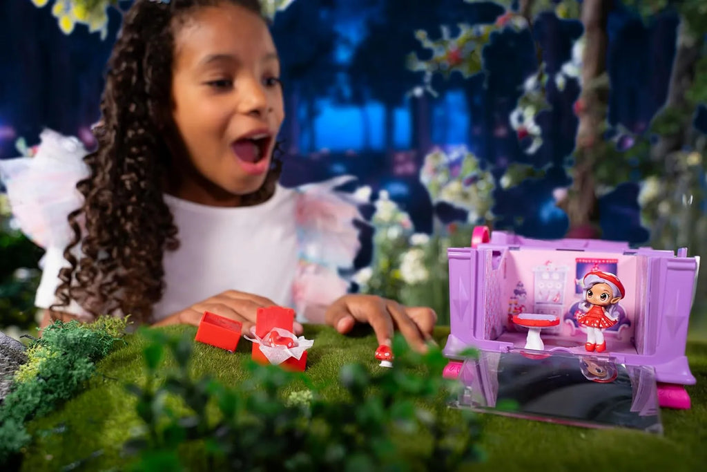 Child playing with a toy set in a garden setting
