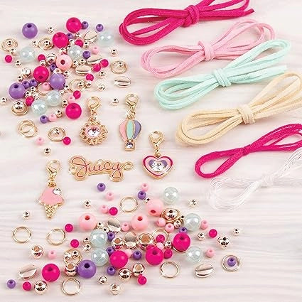 Assorted jewelry-making supplies including beads, charms, and ribbons on a light background