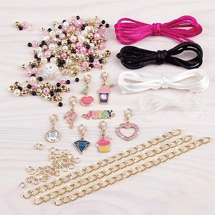 Collection of jewelry-making supplies including beads, charms, and chains on a white background