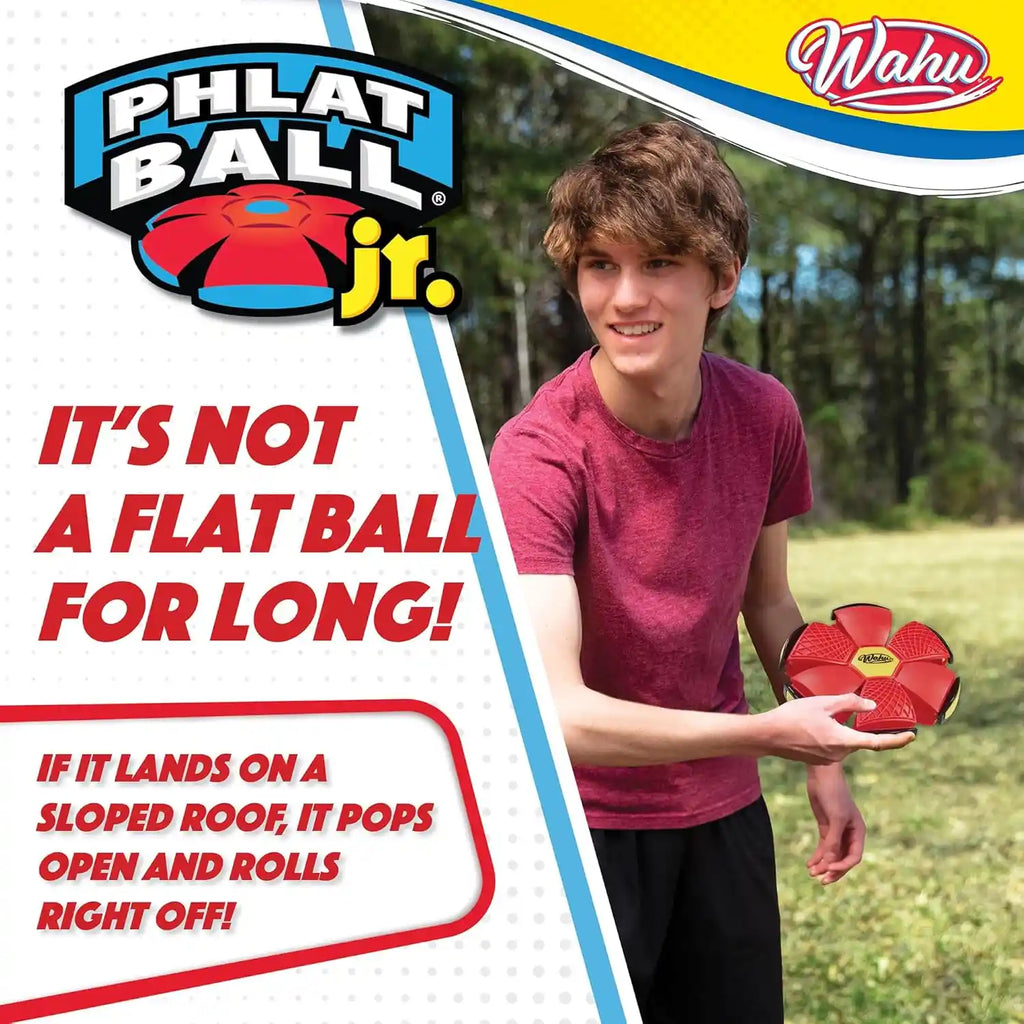 Close-up of a kid holding the WAHU Phlat Ball Junior in red, demonstrating its compact size.